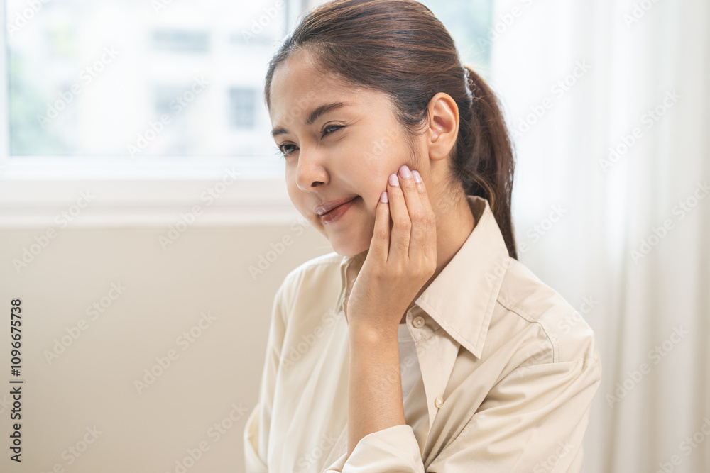 Jaw pain, health care concept. Teeth pain and dentistry asian young woman, girl suffering touching her cheek. Female feeling painful toothache. Unhappy feel bad, diseases in oral, ache nerve and molar Jaw pain, health care concept. Teeth pain and dentistry asian young woman, girl suffering touching her cheek. Female feeling painful toothache. Unhappy feel bad, diseases in oral, ache nerve and molar