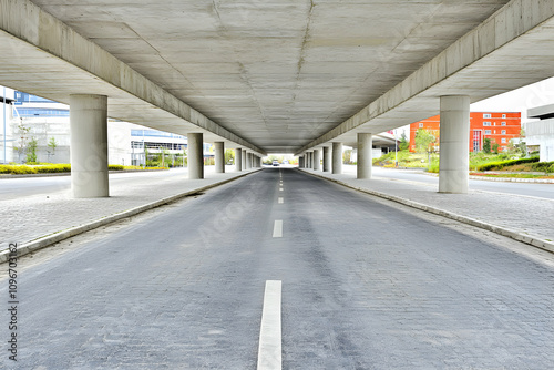 Modern urban underpass, concrete structure, road perspective, architectural design, city infrastructure, transportation.