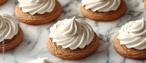 Gingerbread cookies with buttercream frosting on marble surface creating festive sandwich treats for holiday celebrations and baking inspiration