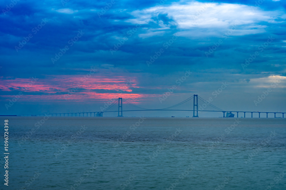 a cross-sea bridge in a cloudy morning a cross-sea bridge in a cloudy morning