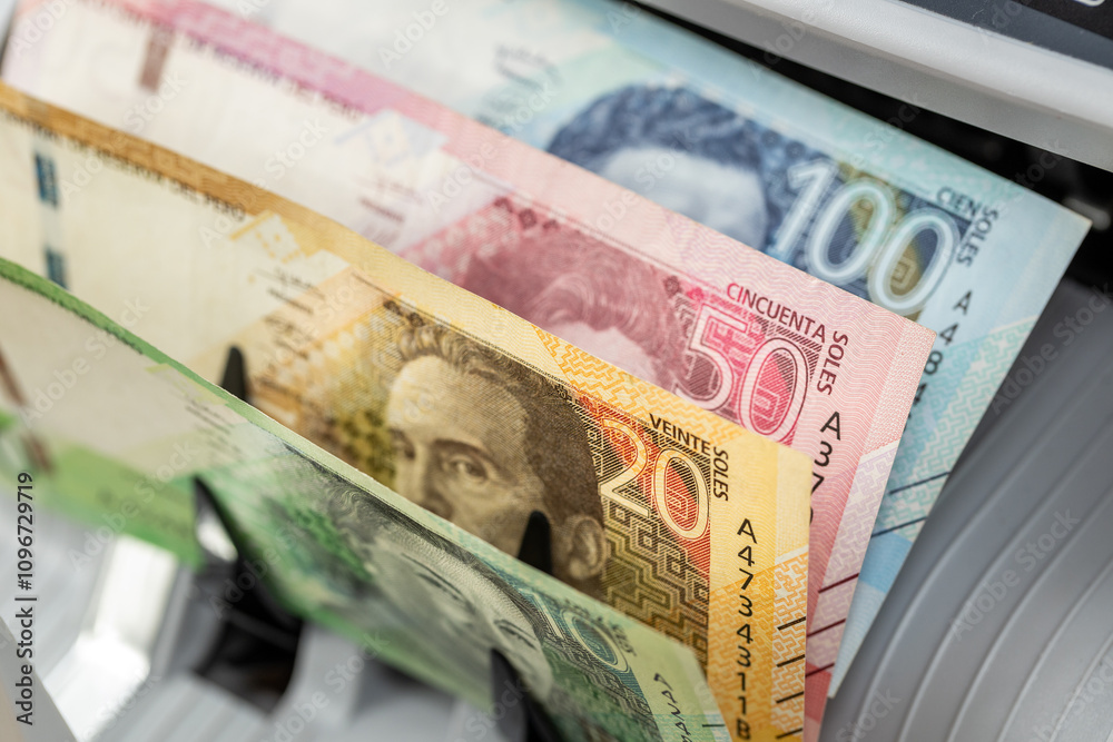 Peru money. Money counting machine with Peruvian soles. Business concept. Financial operations in Peru