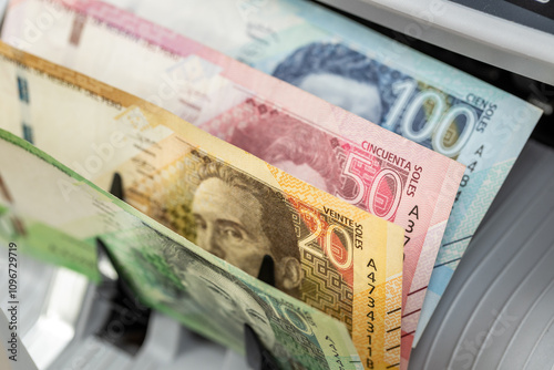 Obraz na płótnie Peru money. Money counting machine with Peruvian soles. Business concept. Financial operations in Peru w salonie