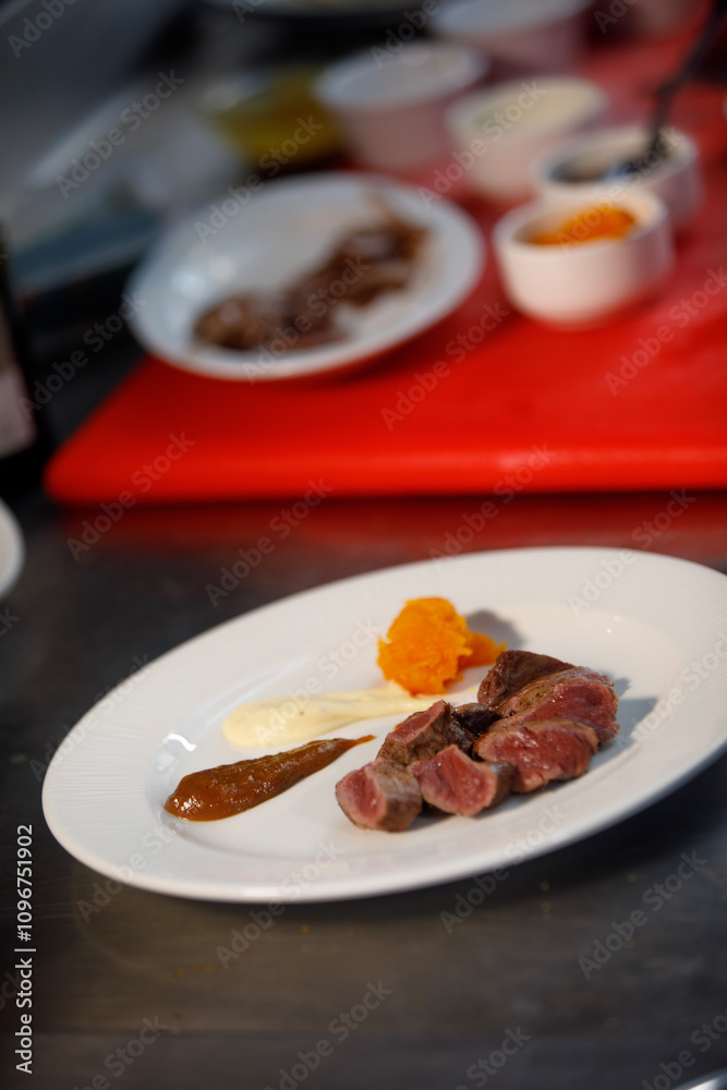 Ready to be eat, plate of cooked meat with sauces in side Ready to be eat, plate of cooked meat with sauces in side