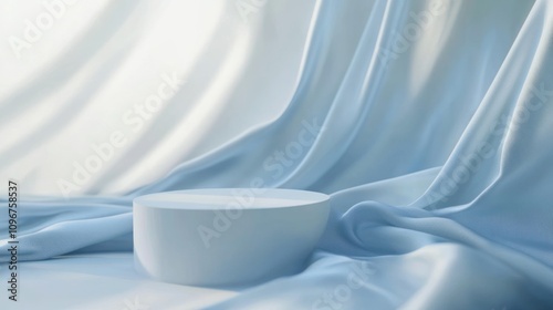 Serene Minimalist Product Display: Light Blue Silk Drape and Cylindrical Pedestal