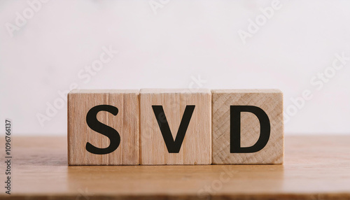 Wooden cubes with abbreviation SVD on table. Singular Value Decomposition. Small Vessel Disease. photo