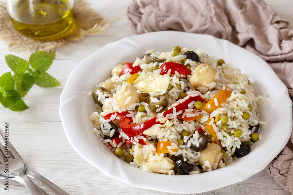 Italian Style Rice Salad on a white dish and light background Italian Style Rice Salad on a white dish and light background