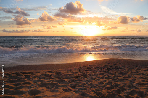 Fototapeta Naklejka Na Ścianę i Meble -  Beautiful sunset on the beach on a summer evening