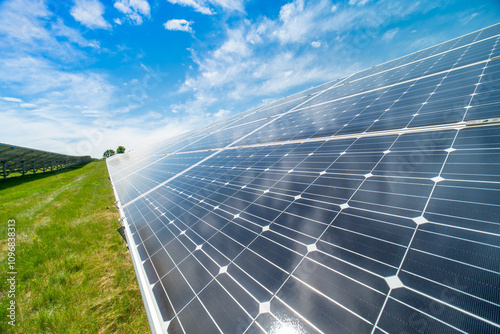 Solar power capturing station and storage plant. Solar panels farm wide geometric view. Renewable eco-friendly energy and green technology reducing carbon footprint and environmental impact. photo