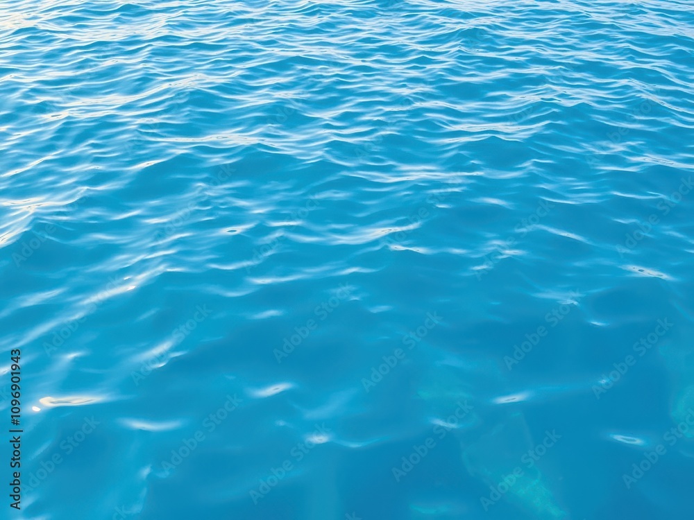 Rippled surface of blue water with gentle waves, waves Rippled surface of blue water with gentle waves, waves