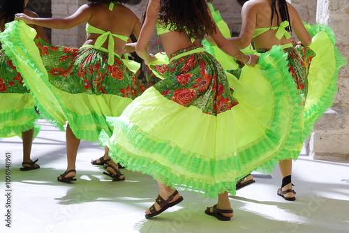 Dancers dancing and wearing one of the traditional folk costume from Brazil photo