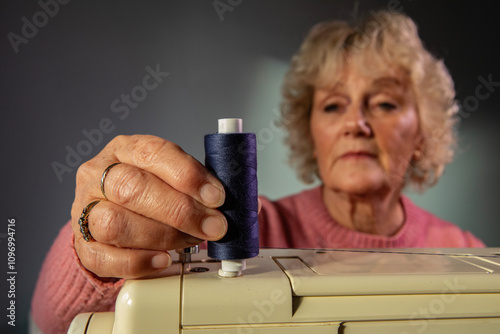 A hobbyist using an electric  sewing machine