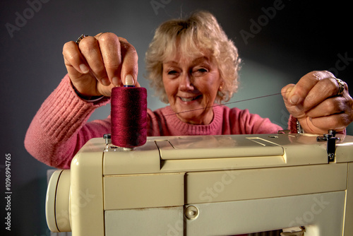 A hobbyist using an electric  sewing machine