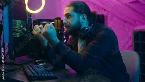 Photos Addicted angry Caucasian guy streamer blogger vlogger influencer man playing onl