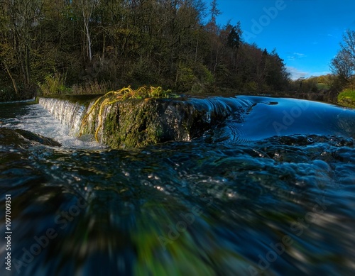 Crystal clear waters of River Lathkill in Derbyshire, UK photo