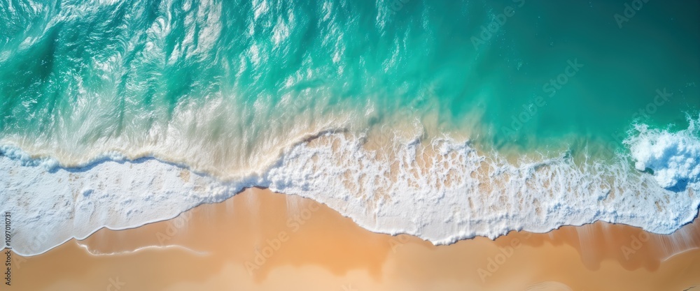 Aerial beach view shows ocean waves crashing on sandy shore. Turquoise water meets white foam. Summer vacation background. Perfect for travel agency website tourism brochure. Use for relaxation, Aerial beach view shows ocean waves crashing on sandy shore. Turquoise water meets white foam. Summer vacation background. Perfect for travel agency website tourism brochure. Use for relaxation,