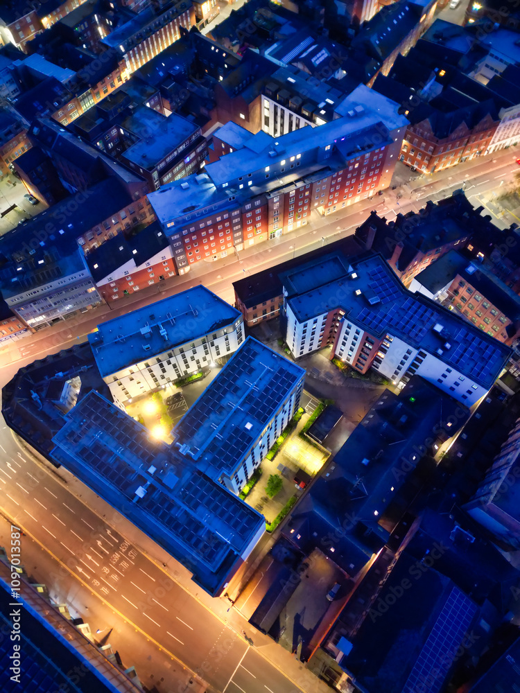 Fototapeta premium High Angle View of Illuminated Historical Central Leicester City of England UK at Night. Aerial Footage Was Captured with Drone's Camera During Midnight of April 26th, 2024 from Medium High Altitude.