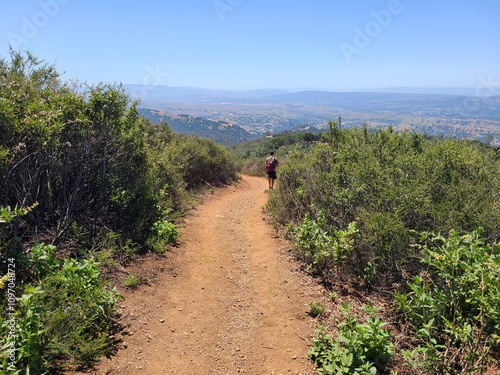 Photography Hiker on the Summit trail at Mt Diablo State Park, California