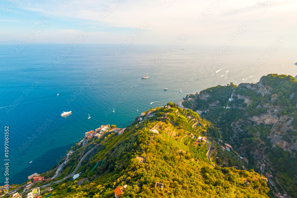 The photo showcases the scenic villas of Ravello and its surroundings, set atop cliffs with panoramic views, lush gardens, and charming architecture that capture the essence of Italy’s Amalfi Coast.