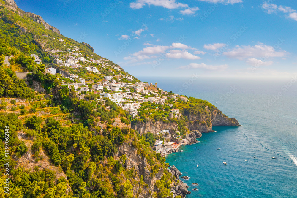 The photo of the stunning Amalfi Coast from a cruise ship deck, showcasing cliffs, charming villages, and lush landscapes against the turquoise sea and vibrant blue sky. Positano, Amalfi, Atrani