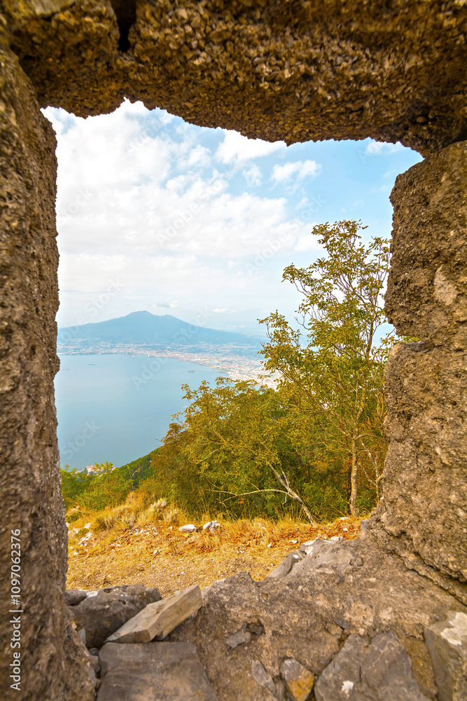 The photo offers a panoramic view of Naples from Monte Molare, overlooking the city and coastline from the water side, with stunning scenery of urban landscapes set against the vast sea and sky.