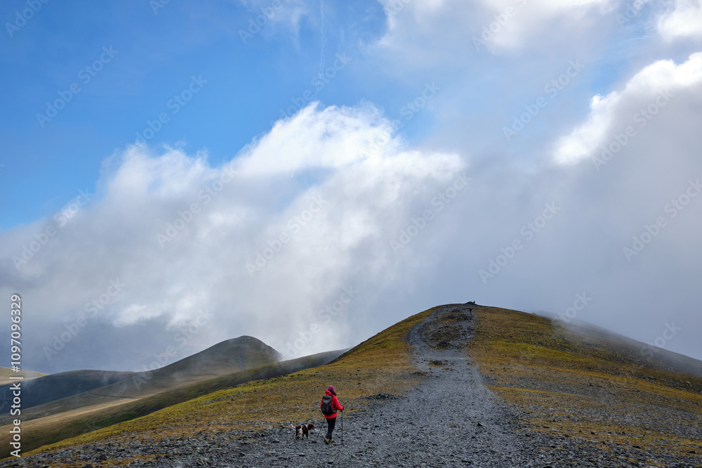 Hiking along the summit of Skiddaw, Keswick, Lake District, UK Hiking along the summit of Skiddaw, Keswick, Lake District, UK