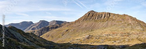 Panorama of the summits of Scafell Pike and Bowfell seen on the descent of Crinkle Crags, Lake District, UK