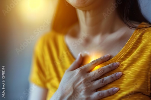 Woman Experiencing Breast Pain in Hand photo