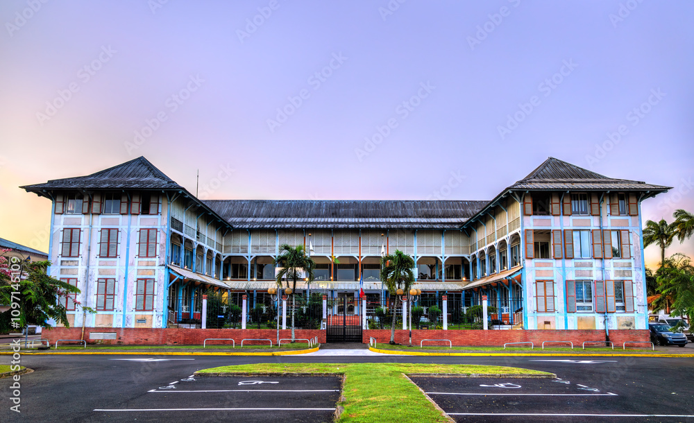 Naklejka premium Chamber of Commerce and Industry Building in Cayenne, French Guiana at sunset
