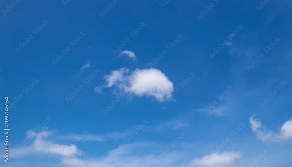 Fototapeta premium 파란 하늘에 떠있는 구름 한점