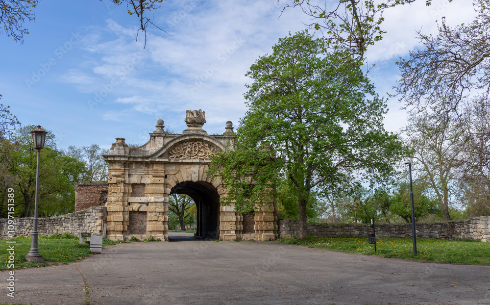 Fototapeta premium Large archway with a stone wall on either side