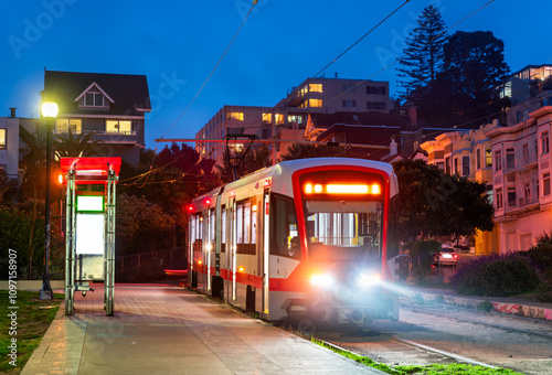 Light Rail Streetcar Stopped at Mission Dolores Park at Night in San Francisco, California, USA