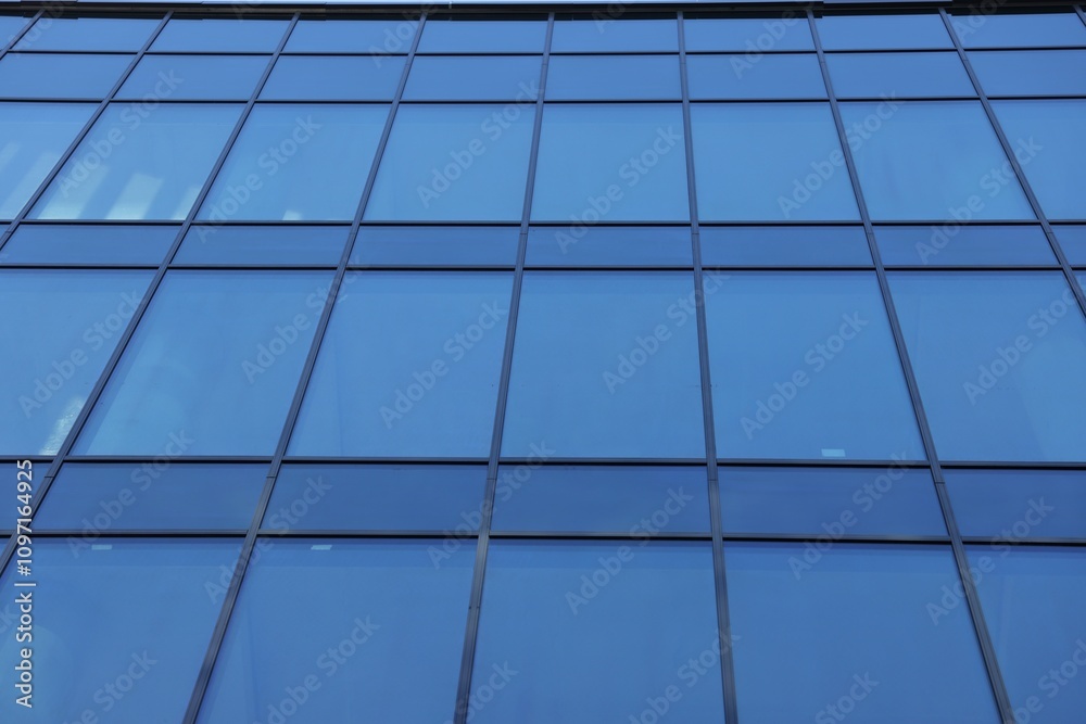 Exterior of modern building with many windows, low angle view Exterior of modern building with many windows, low angle view
