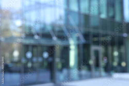 Blurred view of modern building with many windows outdoors