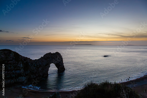 Durdle door after sunset, Image shows the evening view after golden hour and the night sky beginning to show photo