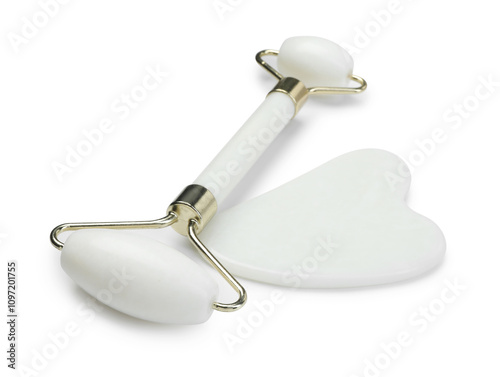 Face roller and gua sha tool isolated on white photo