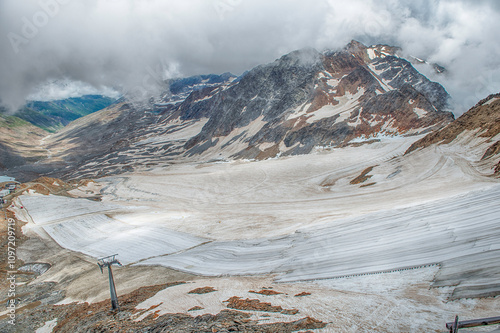 Schnalstal Glacier melting under dramatic sky in Italian Alps photo