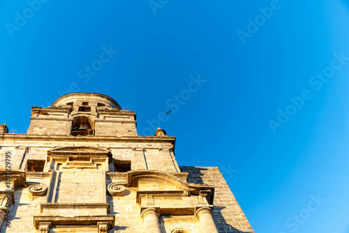 Walking in old part of Jerez de la Frontera, Sherry wine making town, Andalusia, Spain in summer, architectural details, Andalusian style, churches and towers photo