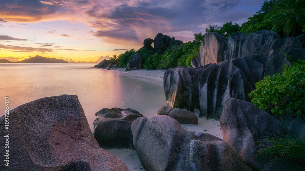 sunset at tropical beach anse source d'argent on la digue on the seychelles