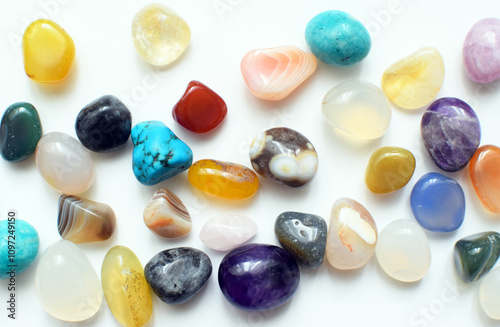 Multicolored healing chakra crystals. Real semi-precious stones: amethyst, rose quartz, agate, turquoise, citrine, apatite.