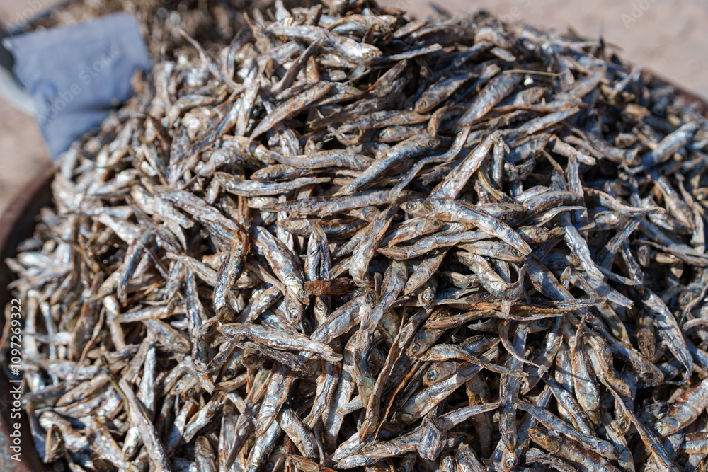 Sale of dried small fish at a small city market Sale of dried small fish at a small city market