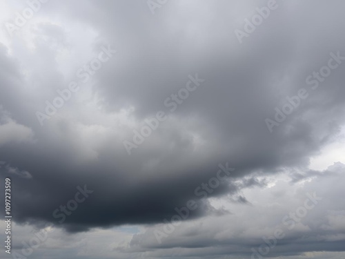 Panorama of cumulus white and dark gray storm clouds in rainy weather, atmospheric conditions, climate