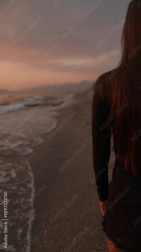 A Serene Beach Sunset Reflection Featuring a Solitary Figure Standing by the Waters Edge A Serene Beach Sunset Reflection Featuring a Solitary Figure Standing by the Waters Edge