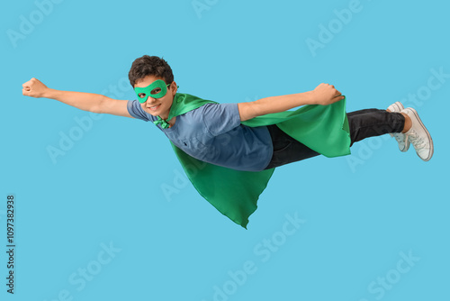 Teenage boy dressed as supe...