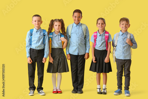 Little pupils in school uni...