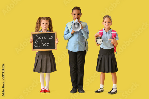 Little pupils holding chalk...