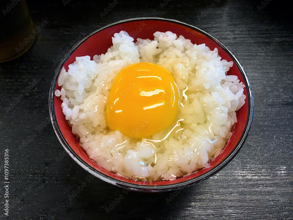 Japanese cuisine, raw egg on rice, tamago kake gohan, Japanese breakfast, comfort food, simple Japanese dish, egg rice, traditional Japanese food, savory breakfast, egg bowl, authentic Japanese dish, 