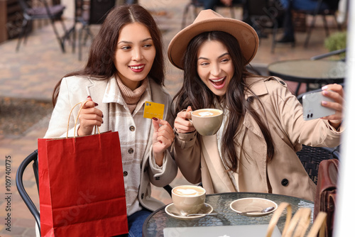 Female friends with shoppin...