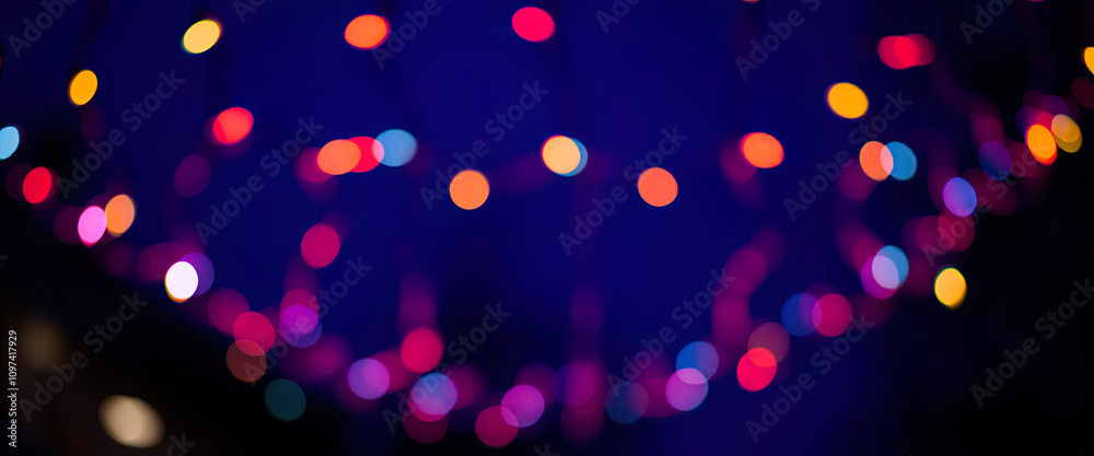 Naklejka premium A Christmas tree with lights is lit up and is on a dark background Ai Generated