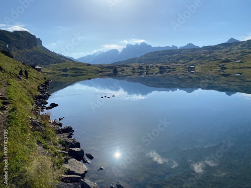 The alpine lake Melchsee or Melch Lake in the Uri Alps mountain massif, Kerns - Canton of Obwald, Switzerland (Kanton Obwalden, Schweiz) photo