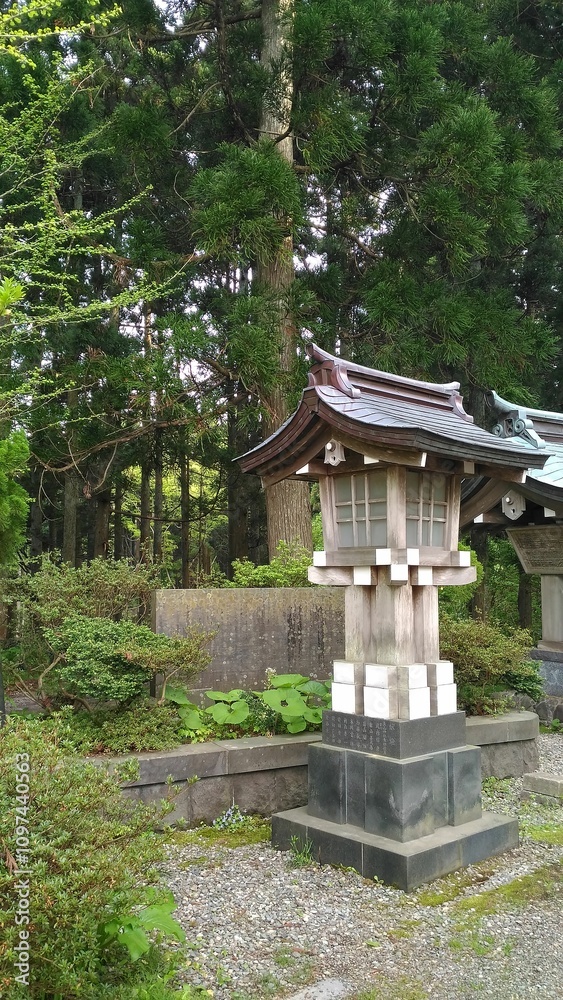 Asian temple lantern. Atmospheric shrine architecture surrounded by greenery. Landscape design in Japan Asian temple lantern. Atmospheric shrine architecture surrounded by greenery. Landscape design in Japan